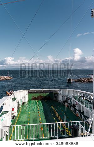 Car Ferry Between Mortavika And Arsvågen In Port With Empty Car Deck On A Bright Day, Mortavika Norw