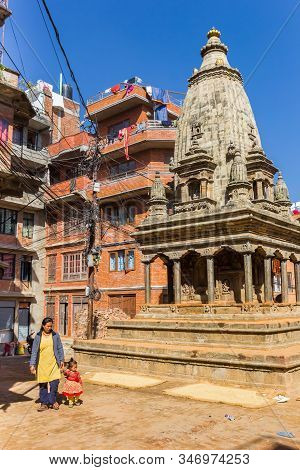 Kirtipur, Nepal - November 15, 2019: Mother And Child At The Lohan Dehar Temple In Kirtipur, Nepal