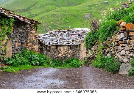 View Of The Ushguli Village At The Foot Of Mt. Shkhara. Lamaria Monastery, Rock Tower Towers And Old