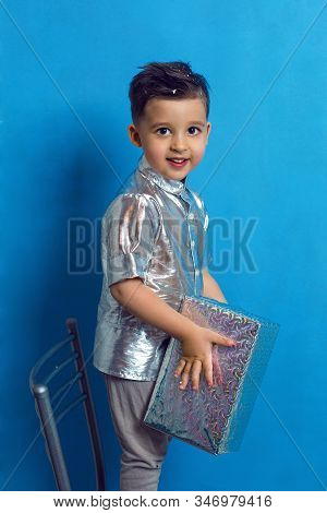 Child A Boy Of Three Years Old With A Fashionable Hairstyle