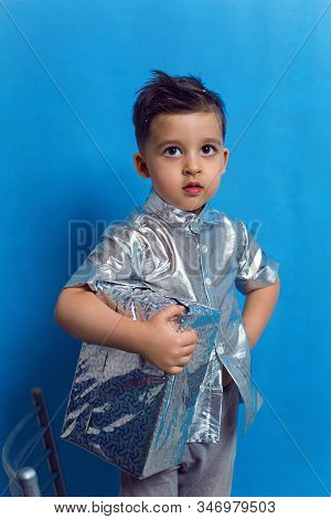 Child A Boy Of Three Years Old With A Fashionable Hairstyle