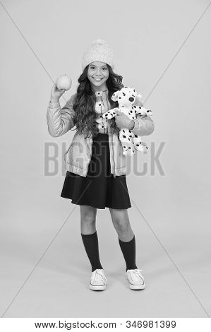 Schooltime Concept. Back To School. Happy Small Girl Hold Toy Dog. Winter Holiday Vacation. Childhoo