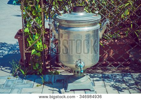 Old Shabby Iron Samovar .vintage Metal Copper Tea . Samovar Side View. Retro Soot Grunge Tea Samovar