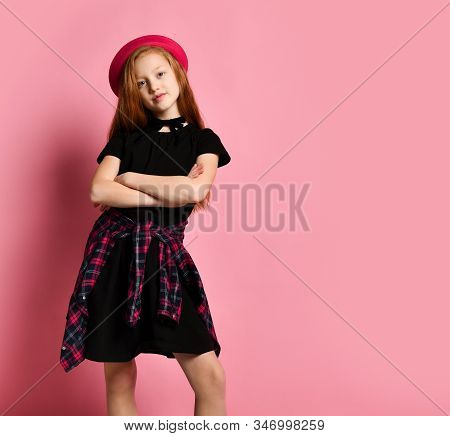 Ginger Teenage Kid In Black Dress, Checkered Shirt On Her Waist, Red Hat And Choker. She Smiling, Ha