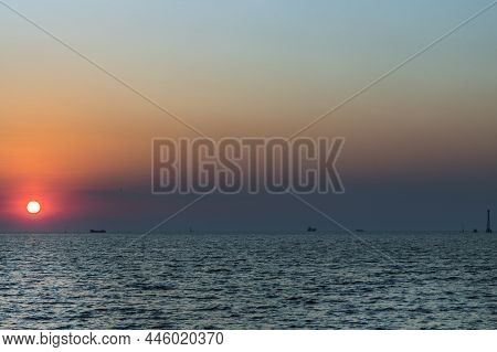 Beautiful Sunset Over A Calm Sea With A Blue And Orange Glowing Sky. Space For Text, Beautiful Sunse