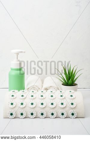 Acupuncture Pillow Massager Applicator And Bottled Massage Oil. Applicator Kuznetsov.