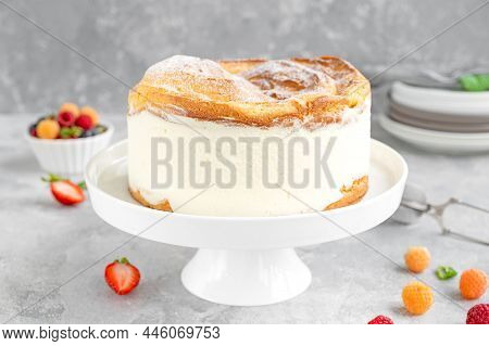 Traditional Polish Cake Karpatka On A Gray Concrete Background. Cake Of Choux Pastry Dough And Custa