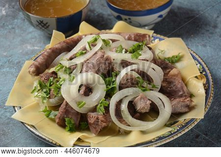 Beshbarmak - National Kazakh Dish, Prepared With Meat And Pasta. Beshbarmak Dish Close-up On A Plate
