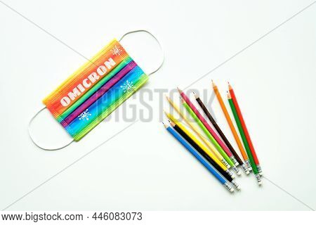 Omicron Corona Virus Variant That Causes Covid. Rainbow Mask With Text Omicron And Virus Particles. 