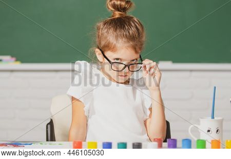 Child Girl Drawing With Coloring Pens Paintind. Portrait Of Adorable Little Girl Smiling Happily Whi