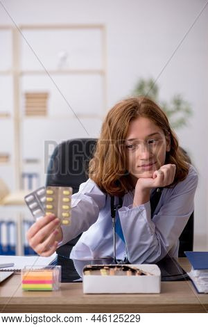 Young female doctor workiing in the clinic