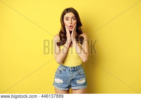 Portrait Of Brunette Woman Reacting Surprised To Advertsement, Gasping And Saying Wow, Wearing Summe