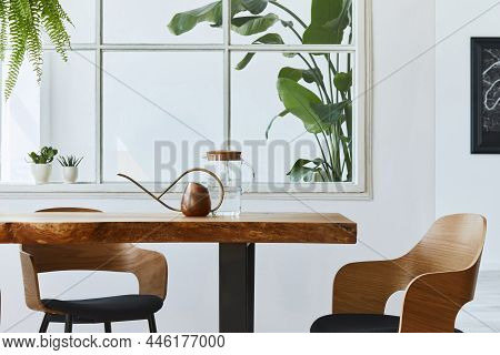 Interior Design Of  Dining Room With Stylish Craft Wooden Family Table, Chairs, A Lof Of Plants, Win