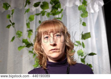 An Inept Photo Of An Ordinary Girl. A Middle-aged Woman In An Indoor Studio. A Picture Of A Selfie O
