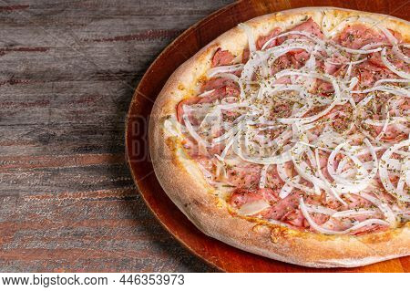 Pepperoni Pizza On Wooden Background. Brazilian Pizza Called Pizza De Calabresa.