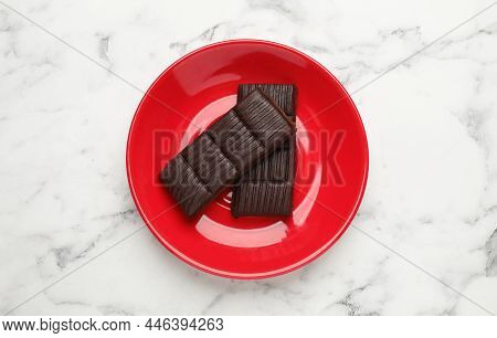 Red Plate With Delicious And Healthy Hematogen On Marble Table, Top View