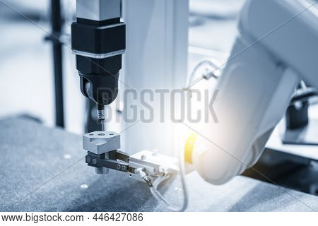 The Robotic System Working With Multi-axis Cmm Machine. The Quality Control Of Automotive Parts With
