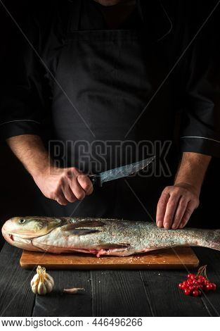 The Chef Prepares Silver Carp Fish. Preparing For The Preparation Of Fish Food For The Holidays. Wor