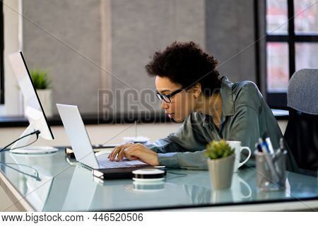African Woman Bad Posture Working Typing At Desk
