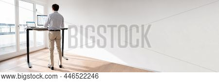 Adjustable Height Desk In Office. Adjusting Stand Posture