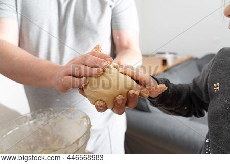 Close Up View Of The Caucasian Father Helping To His Child Daughter Adding And Mixing Ingredients In