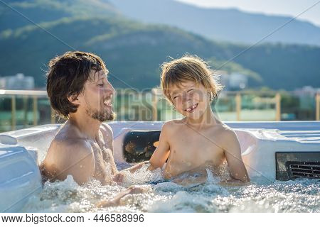 Portrait Of Young Carefree Happy Smiling Happy Family Relaxing At Hot Tub During Enjoying Happy Trav