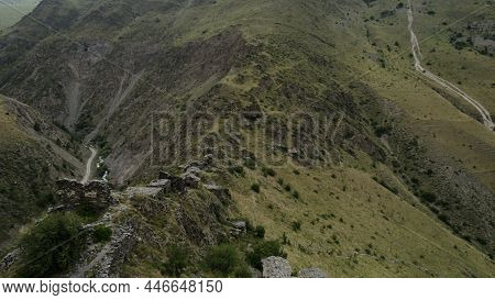 Aerial View Of Green Summer Hills Covered By Trees. Action. Breathtaking Natural Landscape With Moun
