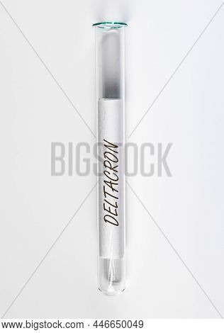 Deltacron Covid Variant. Delta Strain In Glass Lab Tube.