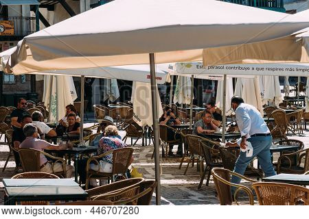 Chinchon, Spain - June 26, 2021: People Enjoying Sitting In The Terrace Of A Bar In Plaza Mayor Of C