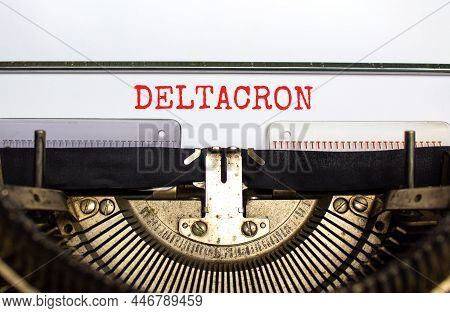 Covid-19 Corona Deltacron Symbol. The Concept Word Deltacron Typed On Retro Typewriter. Beautiful Wh