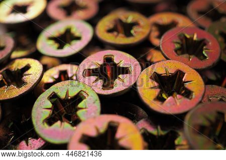 Anodized Screw Caps Close-up. A Vivid Illustration On The Theme Of Hardware And Fasteners. Materials