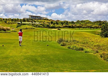 The Golfer Made A Shot And Observes The Flight Of The Ball. Mauritius Island.