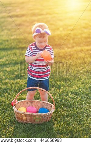 Toddler Eggs Hunters Close-up. Children Activity For Easter In Nature.