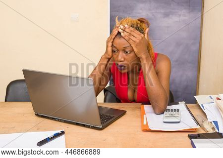 Depressed Young Woman In The Office. Portrait Of Beautiful Young Woman Feeling Sick, Having A Headac