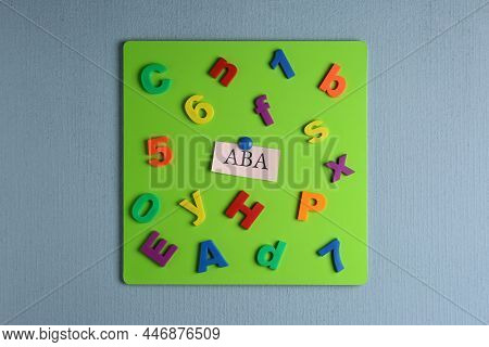 Magnetic Board With Abbreviation Aba (applied Behavior Analysis), Colorful Letters And Numbers On Li