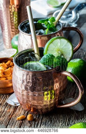 Close Up Of A Moscow Mule Mocktail With Bamboo Straws, Ready For Drinking.