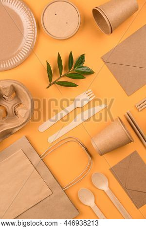 Vertical Image With Eco-friendly Tableware - Kraft Paper Food Packaging On Yellow Or Orange Backgrou