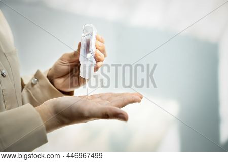 Asian Woman Squeezing Hand Sanitizer Onto Her Hands,people Washing Hand With Alcohol Antiseptic Gel 
