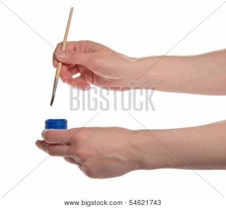 artist's hands holding paintbrush