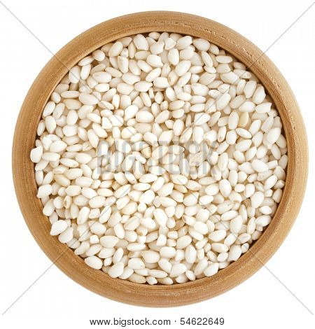 Rice Grain in wooden bowl top view surface  isolated on white background