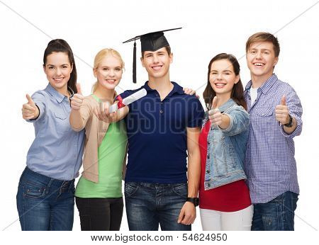 education and people concept - group of standing smiling students with diploma and corner-cap showing thumbs up