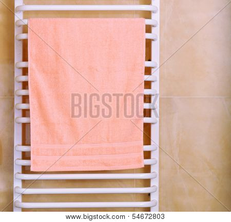 Color towel on  radiator in bathroom