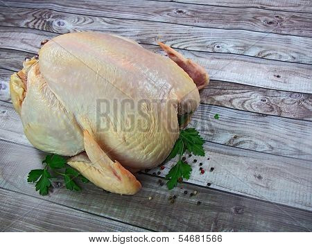 Raw Organic Chicken On Wooden Background