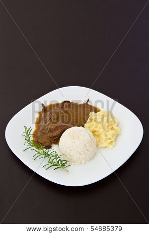 Roast eye of round with roti sauce dish - vertical image
