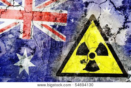 Old Cracked Wall With Radiation Warning Sign And Painted Flag