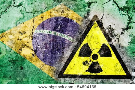 Old Cracked Wall With Radiation Warning Sign And Painted Flag