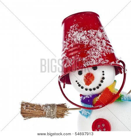 Cheerful snowman with red color bucket on his head and broom in hand isolated on white background 