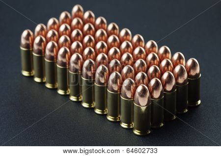 Fifty 9 mm bullet cartridges