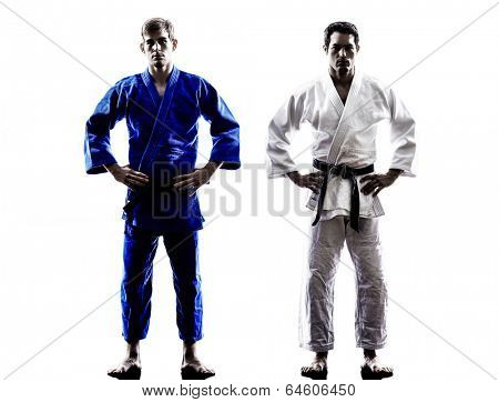 two judokas fighters fighting men in silhouettes on white background