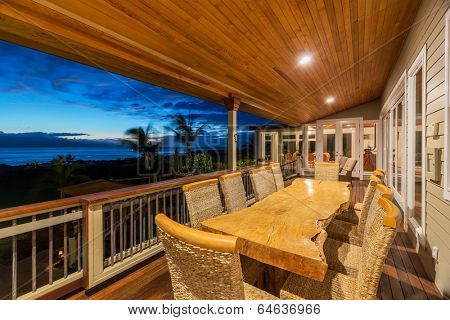 Beautiful Home Exterior Patio Deck and Dining Table with Sunset View